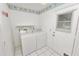 Clean laundry room with washer and dryer at 7101 Scenic Pl, Lakeland, FL 33810
