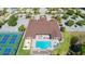 Aerial view of community clubhouse with pool and pickleball courts at 715 Teaberry Trl, Polk City, FL 33868