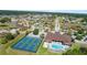 Community overview featuring pool, clubhouse, and pickleball courts at 715 Teaberry Trl, Polk City, FL 33868