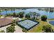 Community overview with lakefront clubhouse and courts at 715 Teaberry Trl, Polk City, FL 33868