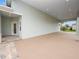 Covered patio with entrance to the house and parking area at 715 Teaberry Trl, Polk City, FL 33868