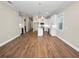 Bright dining room with hardwood floors and chandelier at 715 Teaberry Trl, Polk City, FL 33868
