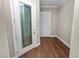 Inviting entryway with wood-look floors and glass door at 715 Teaberry Trl, Polk City, FL 33868