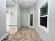 Side exterior view with paver patio and glass door at 715 Teaberry Trl, Polk City, FL 33868