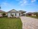 Charming single story home with landscaped yard and paver driveway at 715 Teaberry Trl, Polk City, FL 33868
