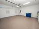 Attached garage with epoxy floor and extra storage at 715 Teaberry Trl, Polk City, FL 33868