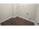 Clean and spacious laundry room with vinyl flooring at 715 Teaberry Trl, Polk City, FL 33868