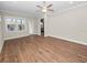Light and airy living area with hardwood floors and sliding glass door at 715 Teaberry Trl, Polk City, FL 33868
