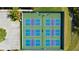 Aerial view of six well-maintained pickleball courts at 715 Teaberry Trl, Polk City, FL 33868