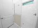 Clean, modern shower with white tile and glass enclosure at 715 Teaberry Trl, Polk City, FL 33868
