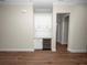 Built-in wet bar with white cabinets and wine cooler at 715 Teaberry Trl, Polk City, FL 33868