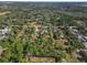 An aerial view showing a house in a rural setting amongst other homes and trees at 748 Mcclellan Rd, Frostproof, FL 33843