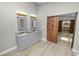 Bathroom with double vanity and a barn door at 748 Mcclellan Rd, Frostproof, FL 33843