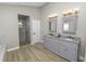 Bathroom boasts double vanity and walk in shower at 748 Mcclellan Rd, Frostproof, FL 33843