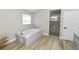 Bathroom with soaking tub, walk-in shower, and double vanity at 748 Mcclellan Rd, Frostproof, FL 33843