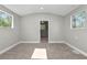 Bright bedroom with neutral walls and carpet flooring at 748 Mcclellan Rd, Frostproof, FL 33843