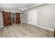 Spacious bedroom featuring barn doors and a chandelier at 748 Mcclellan Rd, Frostproof, FL 33843