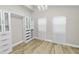 Spacious bedroom closet with built-in shelving and drawers at 748 Mcclellan Rd, Frostproof, FL 33843