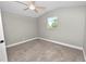 Cozy bedroom with ceiling fan and window at 748 Mcclellan Rd, Frostproof, FL 33843