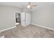 Simple bedroom with closet and access to hallway at 748 Mcclellan Rd, Frostproof, FL 33843