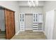 Large walk-in closet with custom shelving and drawers at 748 Mcclellan Rd, Frostproof, FL 33843