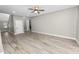 Spacious living room featuring hardwood floors and an open floor plan at 748 Mcclellan Rd, Frostproof, FL 33843