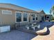 Large brick patio with seating area and generator at 1015 Crossroads Dr, Polk City, FL 33868