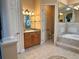 Primary bathroom with soaking tub, shower, and double vanity at 1015 Crossroads Dr, Polk City, FL 33868