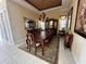 Elegant dining room with large table and hardwood floors at 1015 Crossroads Dr, Polk City, FL 33868