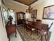 Elegant dining room with large table and hardwood floors at 1015 Crossroads Dr, Polk City, FL 33868