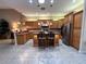 Kitchen with granite counters, stainless steel appliances, and an island with seating at 1015 Crossroads Dr, Polk City, FL 33868