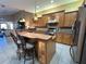Modern kitchen with granite countertops, stainless steel appliances, and an island at 1015 Crossroads Dr, Polk City, FL 33868
