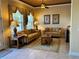 Cozy sitting area with comfortable sofas and a coffee table at 1015 Crossroads Dr, Polk City, FL 33868