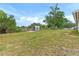 Spacious backyard offering ample green space at 107 W 7Th St, Frostproof, FL 33843