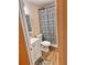 Clean bathroom with white vanity, shower, and modern flooring at 107 W 7Th St, Frostproof, FL 33843