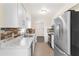 Modern kitchen with stainless steel appliances and white cabinetry at 107 W 7Th St, Frostproof, FL 33843