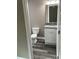 Updated bathroom with white vanity and granite countertop at 1108 Crestview Ave, Lakeland, FL 33805