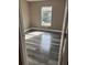 Spacious bedroom with grey wood-look flooring and window at 1108 Crestview Ave, Lakeland, FL 33805