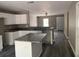 Open concept kitchen with island and granite counters at 1108 Crestview Ave, Lakeland, FL 33805
