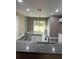 Modern kitchen with granite countertops and white cabinets at 1108 Crestview Ave, Lakeland, FL 33805
