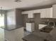 Modern kitchen with granite countertops and white cabinets at 1108 Crestview Ave, Lakeland, FL 33805