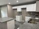 Modern kitchen with white cabinets and granite counters at 1108 Crestview Ave, Lakeland, FL 33805