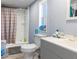 Bathroom with shower, toilet, and sink at 1126 Lakewood W Cir, Lakeland, FL 33801