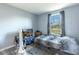 Small bedroom with a single bed and window at 1126 Lakewood W Cir, Lakeland, FL 33801