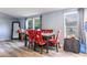 Dining area with a table and red Christmas-themed chairs at 1126 Lakewood W Cir, Lakeland, FL 33801