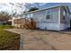 Single-wide mobile home with wood deck and steps at 1126 Lakewood W Cir, Lakeland, FL 33801