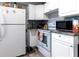 White kitchen cabinets and appliances, including a refrigerator at 1126 Lakewood W Cir, Lakeland, FL 33801