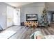 Living room with laminate flooring and Christmas tree at 1126 Lakewood W Cir, Lakeland, FL 33801