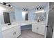 Modern bathroom with double vanity, white cabinets, and black fixtures at 2206 Golden Horseshoe N Cir, Lakeland, FL 33810