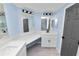 Modern bathroom with double vanity, white cabinets, and black fixtures at 2206 Golden Horseshoe N Cir, Lakeland, FL 33810